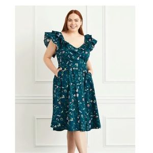 Hill House Ava Dress in Moody Floral. Primarily Teal with pink floral pattern.